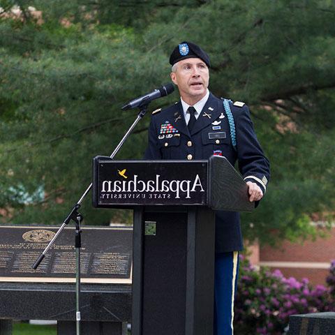 officer giving speech on memorial day